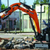 DEVELON DX17Z mini excavator handling construction material