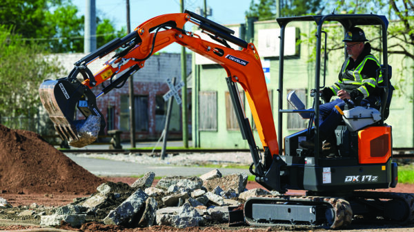 DEVELON DX17Z mini excavator handling construction material