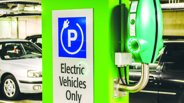 Electric vehicle charging station with designated EV parking.