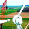 Crane removing a wind turbine blade for recycling and reuse.
