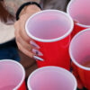Red plastic party cups made from polystyrene gathered for recycling