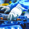 Technician servicing an electric vehicle battery pack as demand for EV battery recycling continues to grow.