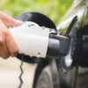 Electric vehicle connected to a DC fast charging station.