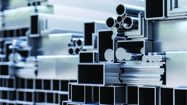 Stacked aluminum extrusions and metal profiles representing the U.S. aluminum supply chain and recycling industry.