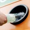 Person returning a beverage container at a reverse vending machine