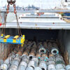 Steel products being loaded into a cargo ship for international transport and U.S. steel imports