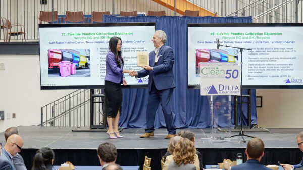 Representatives at an awards ceremony presenting a recognition for Recycle BC and SK Recycles' flexible plastics recycling initiative.