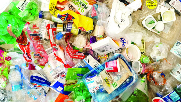 Mixed plastic packaging waste, including bottles, containers and wrappers, illustrating plastics recycling and extended producer responsibility (EPR).